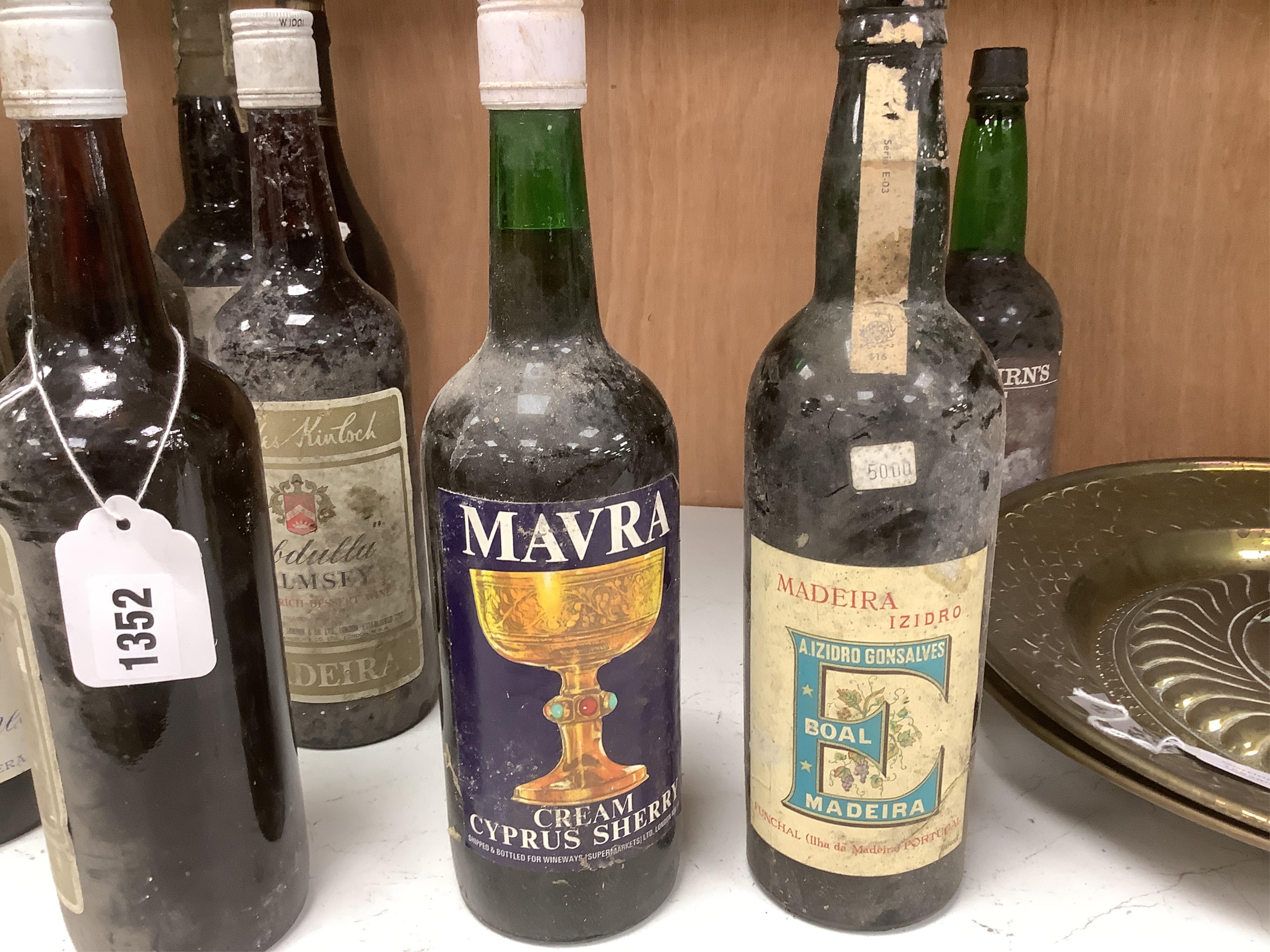 Twelve bottles of various Ports, Madeiras and Sherry, including a bottle of Graham’s vintage Port 1977. Condition - storage unknown